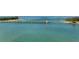 Aerial view of a bridge over a calm waterway, with lush greenery visible on either side at 6810 9Th W Ave, Bradenton, FL 34209