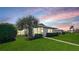 Peaceful backyard with lush landscaping and a view of the community at 6810 9Th W Ave, Bradenton, FL 34209