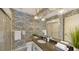 Bathroom with granite countertop and patterned wallpaper at 6810 9Th W Ave, Bradenton, FL 34209
