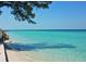 Scenic beach view with calm water and clear sky at 6810 9Th W Ave, Bradenton, FL 34209