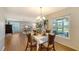 Bright dining area with hardwood floors and large window at 6810 9Th W Ave, Bradenton, FL 34209