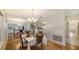 Charming dining area with hardwood floors and a chandelier at 6810 9Th W Ave, Bradenton, FL 34209