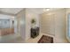 Bright and airy entryway with tile flooring and built-in storage at 6810 9Th W Ave, Bradenton, FL 34209