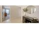 Entryway with tile floors and decorative console table at 6810 9Th W Ave, Bradenton, FL 34209