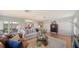 Spacious living room with hardwood floors, comfy seating, and ample natural light at 6810 9Th W Ave, Bradenton, FL 34209