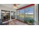 Bright sunroom with ample windows offering scenic views of the surroundings at 6810 9Th W Ave, Bradenton, FL 34209