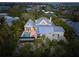 Aerial view showcasing a home's waterfront location and pool at 689 Lands End Dr, Longboat Key, FL 34228