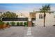 Landscaped backyard with gravel pathway and seating at 689 Lands End Dr, Longboat Key, FL 34228