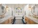 Elegant bathroom with double vanity, freestanding tub, and marble countertops at 689 Lands End Dr, Longboat Key, FL 34228