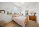 Charming bedroom with wood floors, a gingham bedspread, and built-in dresser at 689 Lands End Dr, Longboat Key, FL 34228