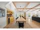Farmhouse-style dining room with a long wooden table and yellow hutch at 689 Lands End Dr, Longboat Key, FL 34228