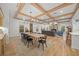 Bright dining room with a large wooden table and hardwood floors at 689 Lands End Dr, Longboat Key, FL 34228