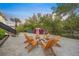 Charming fire pit surrounded by chairs and lush greenery at 689 Lands End Dr, Longboat Key, FL 34228