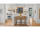 Modern kitchen with white cabinets, marble countertops, and herringbone backsplash at 689 Lands End Dr, Longboat Key, FL 34228