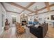 Bright living room with hardwood floors, fireplace and ample natural light at 689 Lands End Dr, Longboat Key, FL 34228