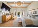 Main bedroom with hardwood floors, large windows, and a view of the pool at 689 Lands End Dr, Longboat Key, FL 34228