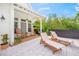 Relaxing patio with rocking chairs and lounge chairs at 689 Lands End Dr, Longboat Key, FL 34228
