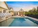 Inviting pool with surrounding patio and seating at 689 Lands End Dr, Longboat Key, FL 34228