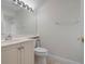 Clean bathroom with vanity, toilet and shower at 7484 Botanica Pkwy # 101 B-24, Sarasota, FL 34238