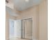 Bright bedroom with mirrored closet doors and neutral walls at 7484 Botanica Pkwy # 101 B-24, Sarasota, FL 34238