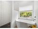 Relaxing bathroom with soaking tub and walk-in shower at 7737 40Th E Ct, Sarasota, FL 34243