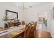 Dining room with view to the pool and backyard at 7737 40Th E Ct, Sarasota, FL 34243