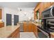 Kitchen with stainless steel appliances and granite countertops at 7737 40Th E Ct, Sarasota, FL 34243