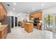 Kitchen with island, granite countertops, and stainless steel appliances at 7737 40Th E Ct, Sarasota, FL 34243