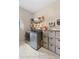 Laundry room with washer, dryer, and storage shelves at 7737 40Th E Ct, Sarasota, FL 34243