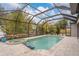 Enclosed pool area with spa and patio at 7737 40Th E Ct, Sarasota, FL 34243