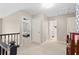 Upstairs hallway with access to bedrooms and bathroom at 7737 40Th E Ct, Sarasota, FL 34243