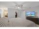 Main bedroom with walk-in closet and TV at 7803 24Th W Ave, Bradenton, FL 34209