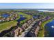 Aerial view of community with golf course, lake, and luxury homes at 8115 Miramar Way # 202, Lakewood Ranch, FL 34202