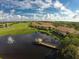 Community overview featuring homes, lake, golf course at 8115 Miramar Way # 202, Lakewood Ranch, FL 34202
