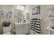 Small bathroom with white vanity and toilet at 8115 Miramar Way # 202, Lakewood Ranch, FL 34202