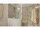 Clean bathroom with a shower and neutral-toned tile at 8115 Miramar Way # 202, Lakewood Ranch, FL 34202