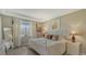 Bright bedroom with a comfortable king-size bed and plenty of natural light at 8115 Miramar Way # 202, Lakewood Ranch, FL 34202