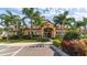 Community clubhouse with inviting exterior and landscaping at 8115 Miramar Way # 202, Lakewood Ranch, FL 34202