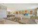 Open concept kitchen with granite island and stainless steel appliances at 8115 Miramar Way # 202, Lakewood Ranch, FL 34202