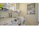 Laundry room with washer, dryer and shelving at 8115 Miramar Way # 202, Lakewood Ranch, FL 34202
