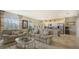 Open concept living room with kitchen and dining area partially visible at 8115 Miramar Way # 202, Lakewood Ranch, FL 34202