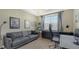 Home office with a couch, desk and window at 8115 Miramar Way # 202, Lakewood Ranch, FL 34202