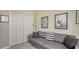 Small home office with gray couch and built-in closet at 8115 Miramar Way # 202, Lakewood Ranch, FL 34202