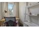 Home office with a desk, chair, and built-in shelving at 8115 Miramar Way # 202, Lakewood Ranch, FL 34202