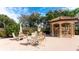 Relaxing poolside seating area with tables and a gazebo at 8115 Miramar Way # 202, Lakewood Ranch, FL 34202