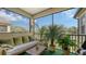 Relaxing screened balcony with seating and lush greenery at 8115 Miramar Way # 202, Lakewood Ranch, FL 34202
