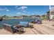 Relaxing waterfront seating area with lake views at 8115 Miramar Way # 202, Lakewood Ranch, FL 34202