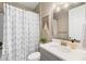 Well-lit bathroom with modern fixtures, and a patterned shower curtain at 9230 Isabella Cir, Parrish, FL 34219