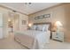 Bright bedroom with ensuite bathroom access at 9490 High Gate Dr # 2013, Sarasota, FL 34238