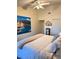 Large bedroom with king-size bed and scenic wall art at 4615 Hidden View Pl # 26, Sarasota, FL 34235